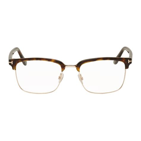 half rimmed tortoise shell glasses.